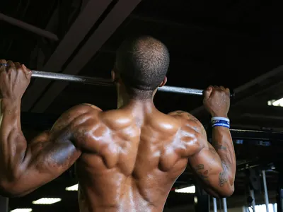 Man doing pull-ups on a bar