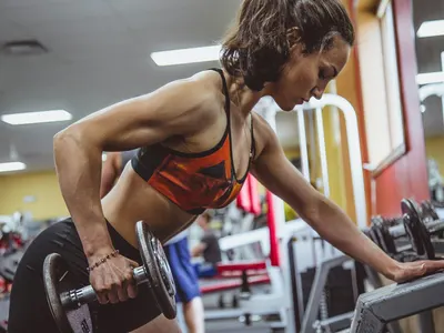 Woman doing a one-arm dumbbell row